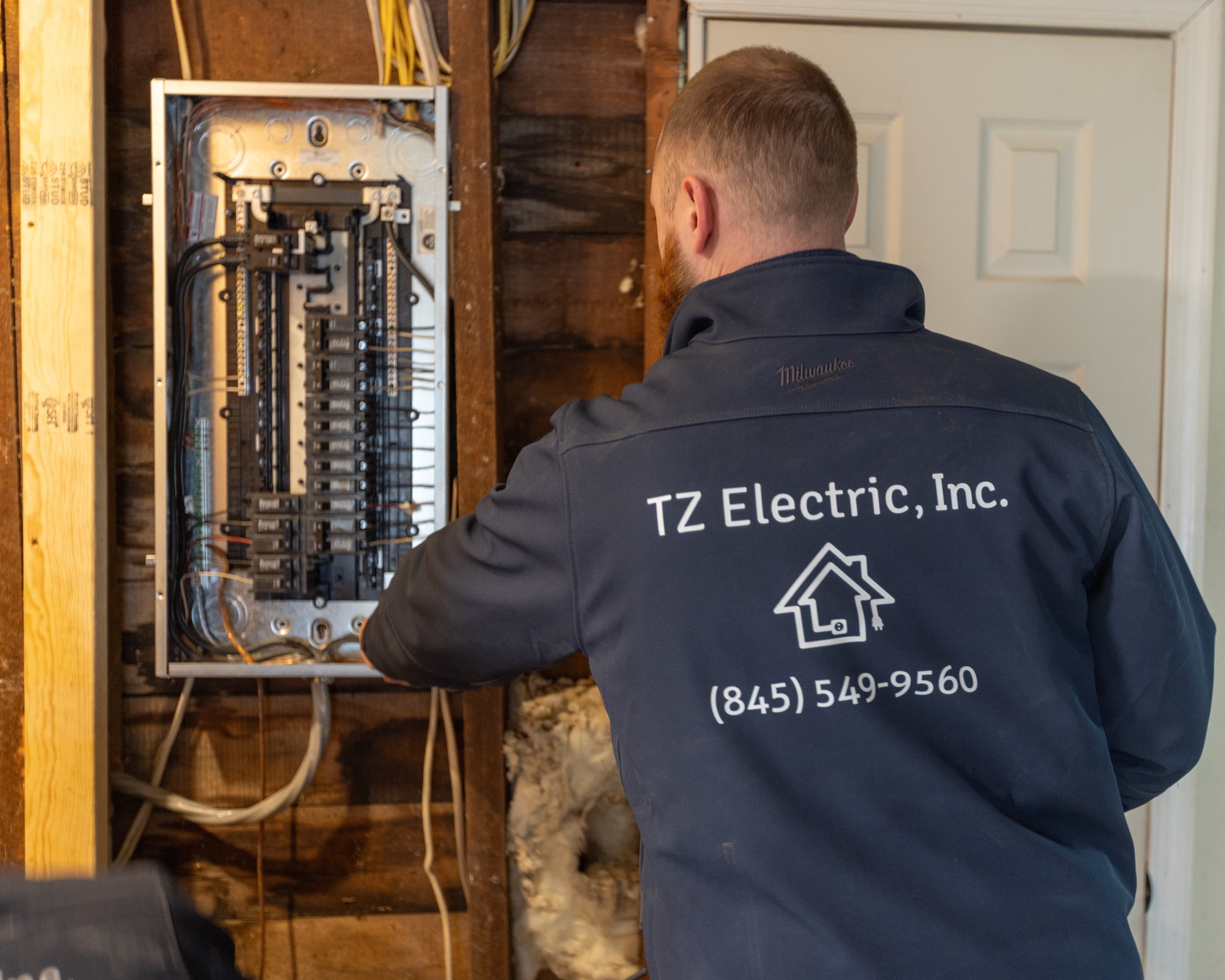 TZ Electric technician working on residential electrical panel upgrade